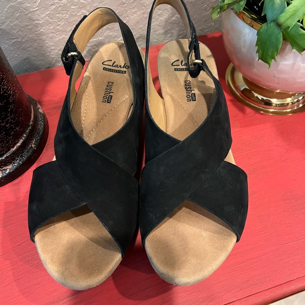 Clarks Black Sandals with Crisscross Straps and Slingback Design